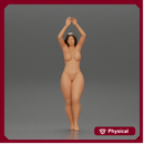 Naked woman standing with her arms raised up on the beach