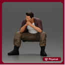 Thoughtful Man Squatting in Casual Outfit, Deep in Contemplation