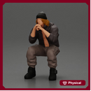 Gangster sitting in thought dressed casually with a beanie and jacket