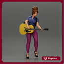 Young woman with short hair standing playing on an acoustic guitar on stage