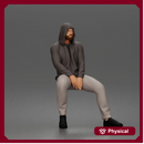 Thoughtful man in hoodie sitting casually with hands resting together