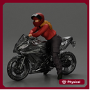 motorcyclist woman in helmet and hoodie sitting on motorcycle