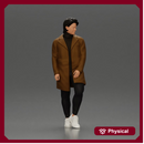 Man in brown coat glances sideways dressed in stylish winterwear