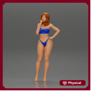 sexy girl in bikini standing smoking cigarette on the beach