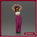 woman striking a heart-shaped pose with joyful energy