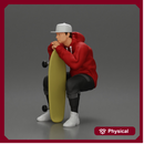 man in hoodie and cap sitting and putting his hand on the skateboard