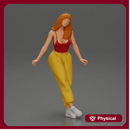 Woman sitting on car in red top yellow pants striking playful pose