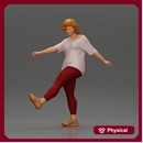 Woman in casual outfit joyfully kicks her leg with energy
