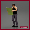Young Man Holding Map And Looking At It While Standing On The City