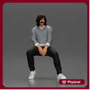 Man in Casual Sweater and Sneakers Sitting with Relaxed Posture