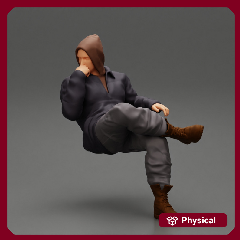 man in leather jacket and jeans sitting cross legged and thinking