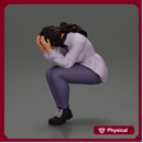 sad girl in a puff-sleeve shirt sitting and crying with her hands covering her face