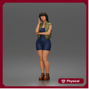 Thoughtful woman stands hand on cheek wearing vest shorts boots