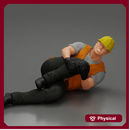 construction worker lying on the floor holding his injured leg