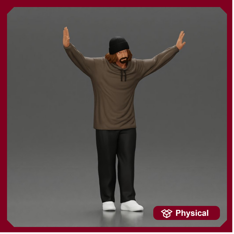 Man wearing hoodie and beanie raises hands looking happy in relaxed stance