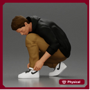 Man in hoodie crouching down tying shoelaces focused in casual outfit