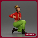 Fashionable woman kneeling in red jacket, green pants, and black boots