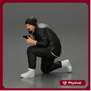 Gangster in hat and jacket sitting and holding a gun hides behind the car
