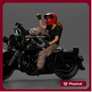 Biker woman in red helmet striking pose on black motorcycle