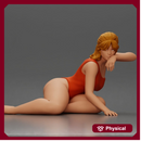 attractive woman in red swimsuit resting calmly on the beach